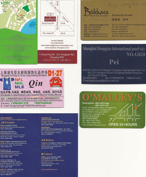 Scan of some useful SH business cards.  Clockwise from upper left:  Latina (green) Brasilian restaurant in the shopping under Science & Tech museum, Sasha's bar/restaurant, Bukhara Indian restaurant near Hong Mei pearl mkt, Card for pearl vendor in Hong Mei Lu (use it to get there), O'Malley's, Blue Frog locations, and card for jersey shop (pink) at Science & Tech museum shopping